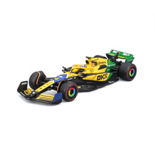McLaren F1 MCL38 Lando Norris #4 GP Monaco 2024 con Livrea Senna 30° Anniversario in scala 1:43 con pilota e teca espositiva